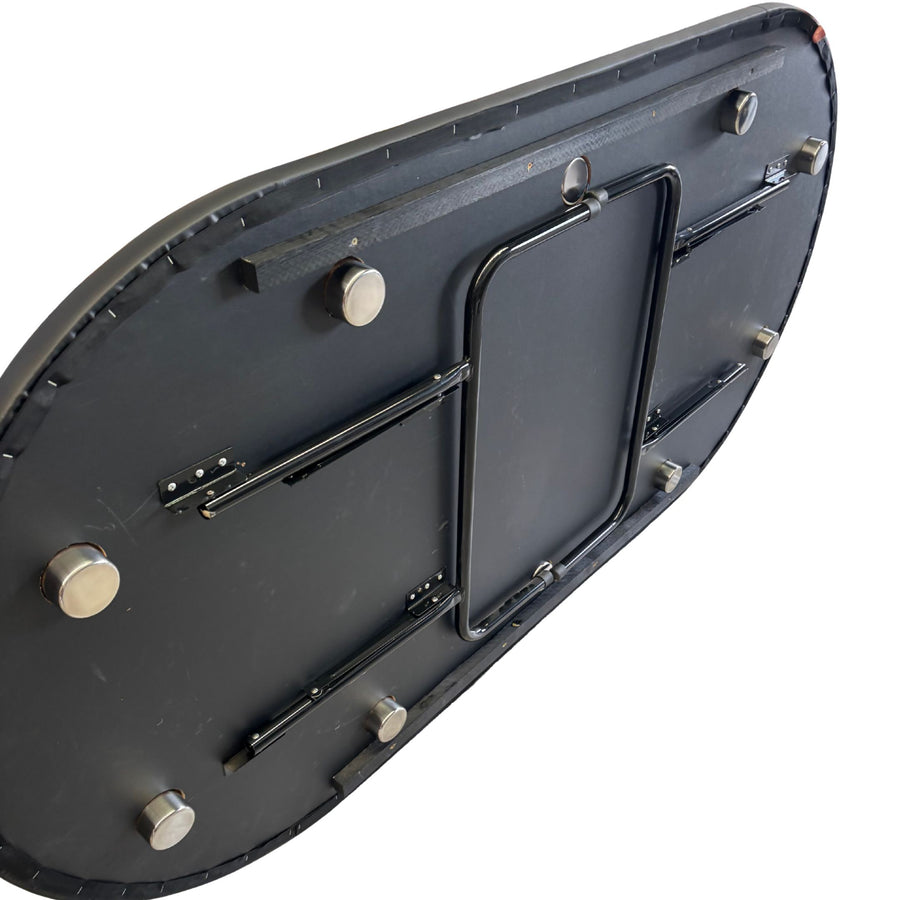 Black metal bracket with multiple screws on a white background