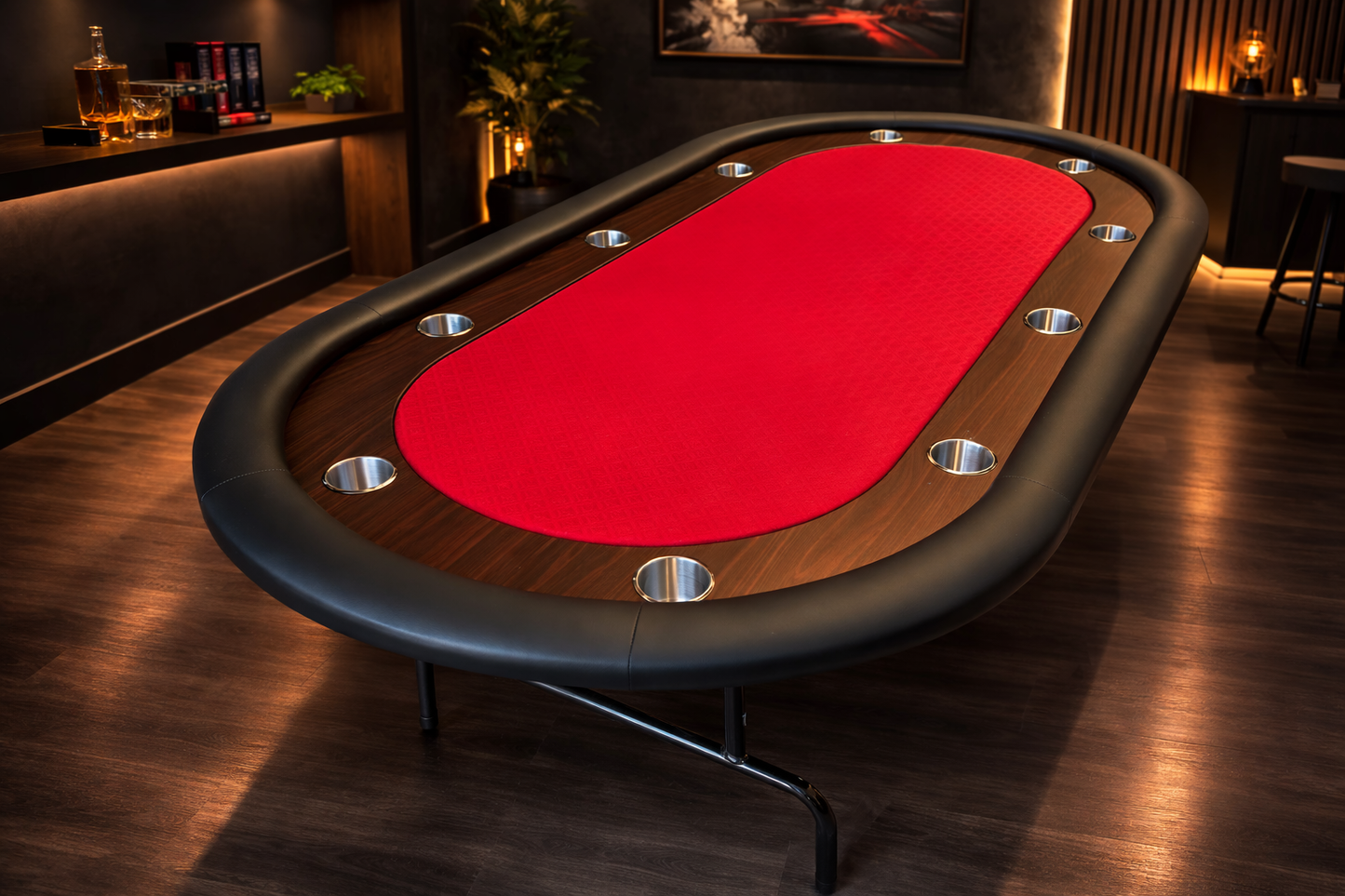 Poker table with red felt surface in a dimly lit room